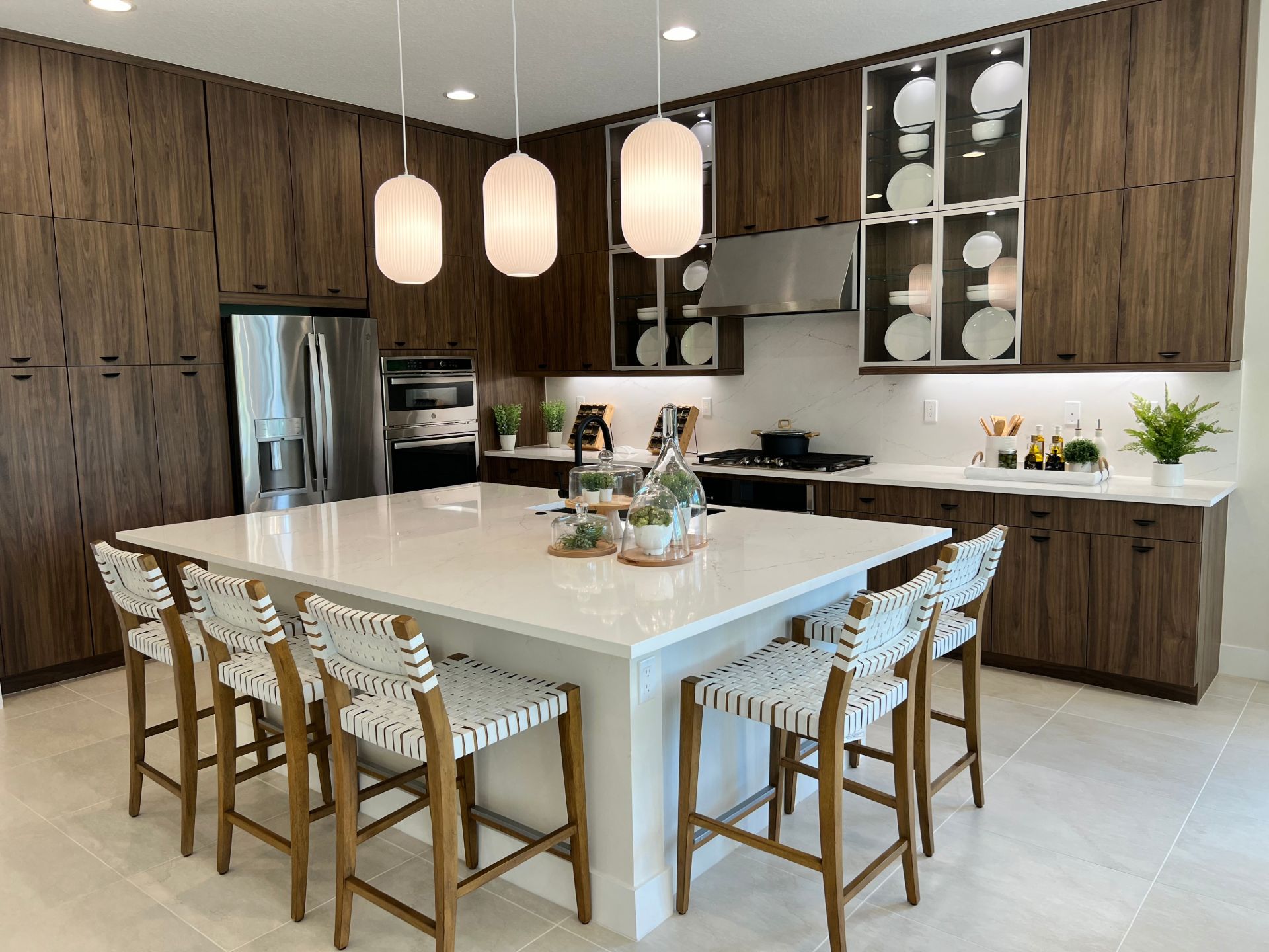 modern-walnut-kitchen-white-quartz-island-statement-lighting